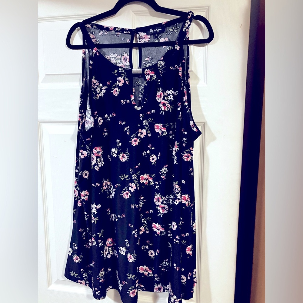 Pink floral print dress on black background, sleeveless with keyhole detailing